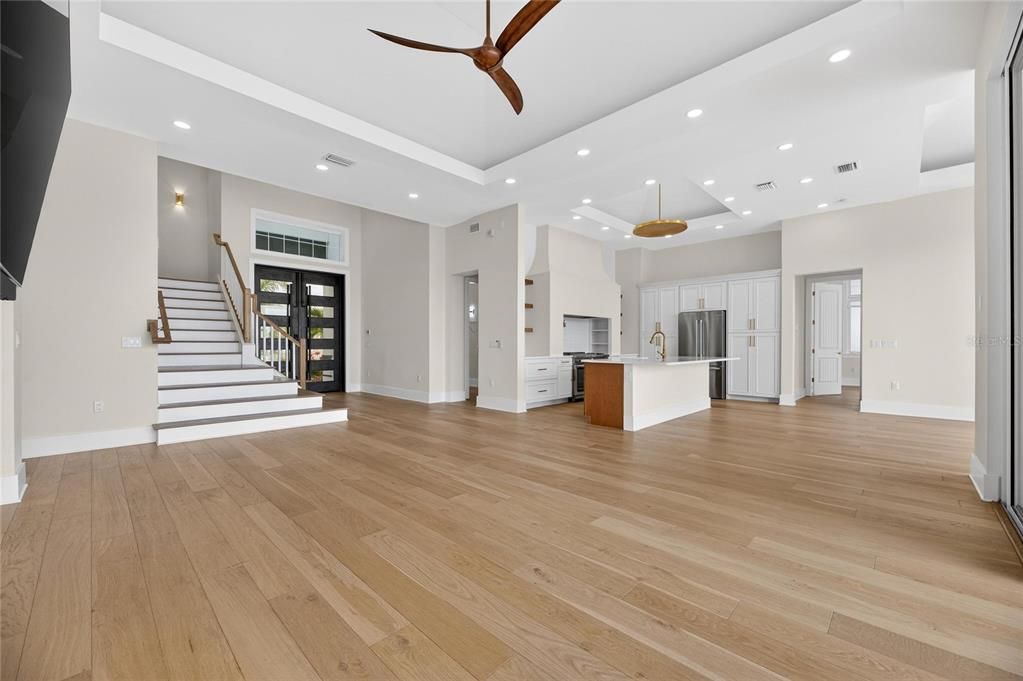 Empty room, Interior, Kitchen, Pendant Lights, Recessed Lighting, Stainless Steel Appliances, Wood Texture Flooring