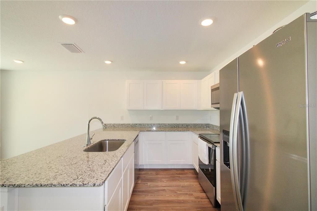 Interior, Kitchen, Recessed Lighting, Stainless Steel Appliances, Wood Texture Flooring