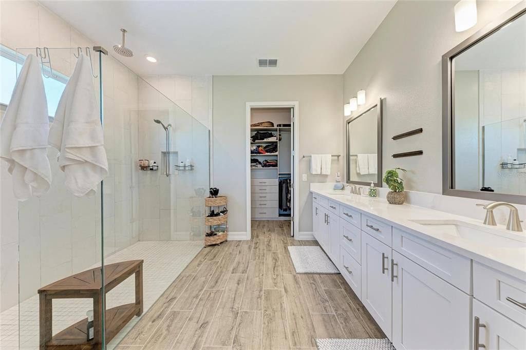 Bathroom, Dual Sink Vanities, Glass Shower, Interior, Recessed Lighting, Walk-in Closets, Wood Texture Flooring
