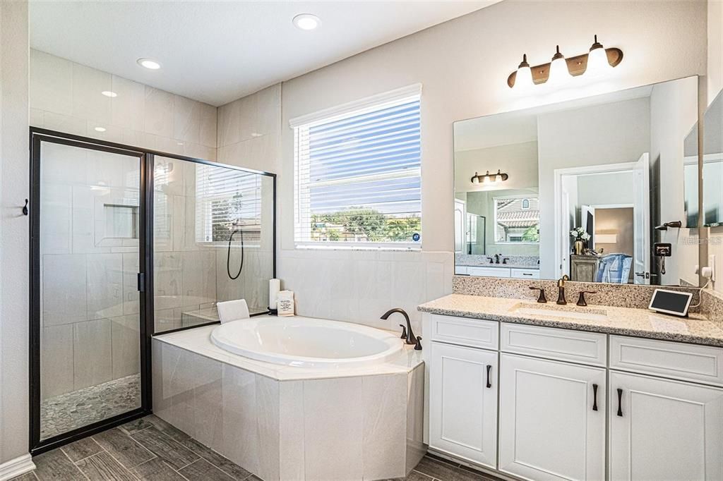 Bathroom, Dual Sink Vanities, Glass Shower, Interior, Recessed Lighting, Wood Texture Flooring