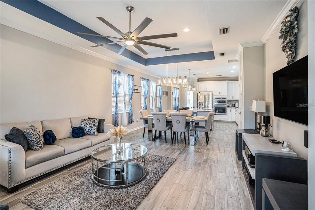 Chandelier, Dining room, Interior, Kitchen, Living room, Pendant Lights, Recessed Lighting, Stainless Steel Appliances, Wood Texture Flooring