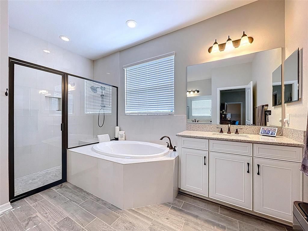 Bathroom, Dual Sink Vanities, Glass Shower, Interior, Recessed Lighting, Wood Texture Flooring