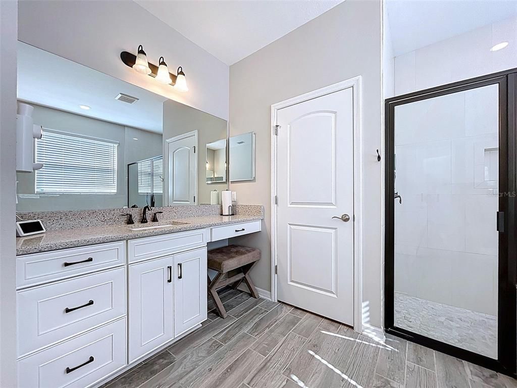 Bathroom, Dual Sink Vanities, Glass Shower, Interior, Recessed Lighting, Wood Texture Flooring