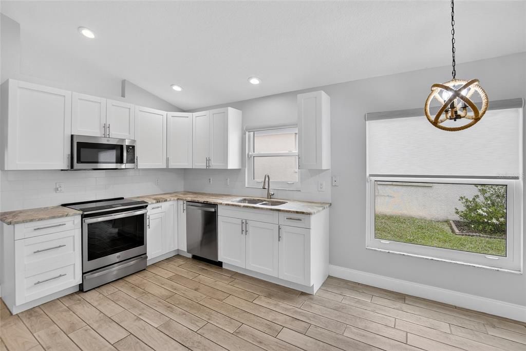 Interior, Kitchen, Pendant Lights, Recessed Lighting, Stainless Steel Appliances, Wood Texture Flooring