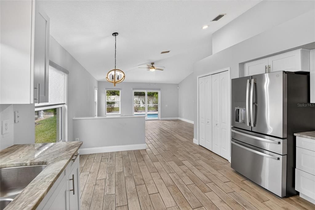 Interior, Kitchen, Pendant Lights, Recessed Lighting, Stainless Steel Appliances, Wood Texture Flooring