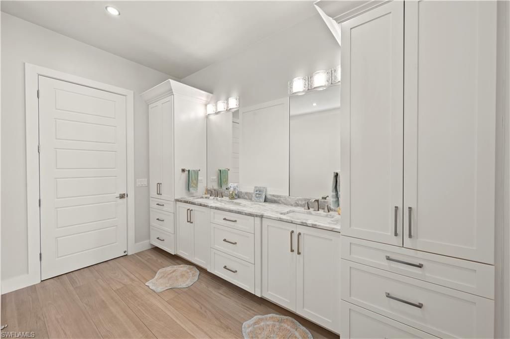 Bathroom, Dual Sink Vanities, Interior, Recessed Lighting, Wood Texture Flooring