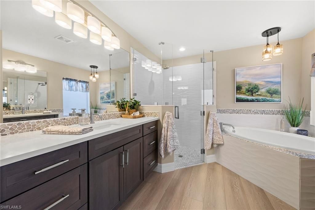Bathroom, Dual Sink Vanities, Glass Shower, Interior, Pendant Lights, Recessed Lighting, Wood Texture Flooring