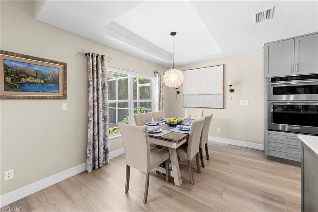 Chandelier, Dining room, Interior, Stainless Steel Appliances, Wood Texture Flooring