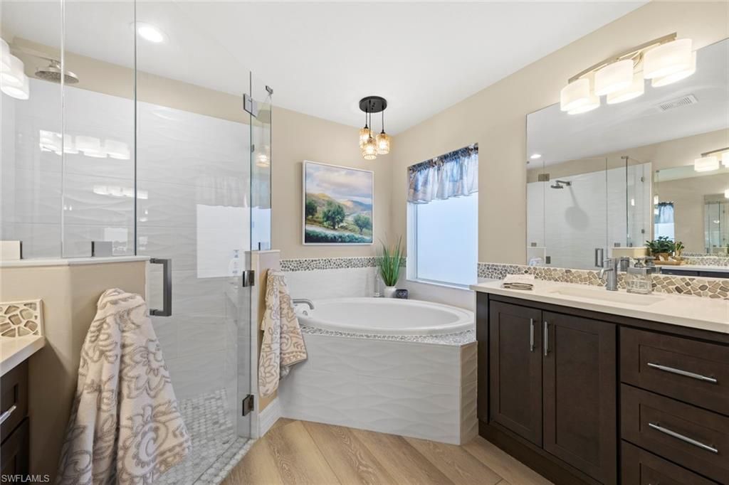 Bathroom, Dual Sink Vanities, Glass Shower, Interior, Pendant Lights, Recessed Lighting, Wood Texture Flooring