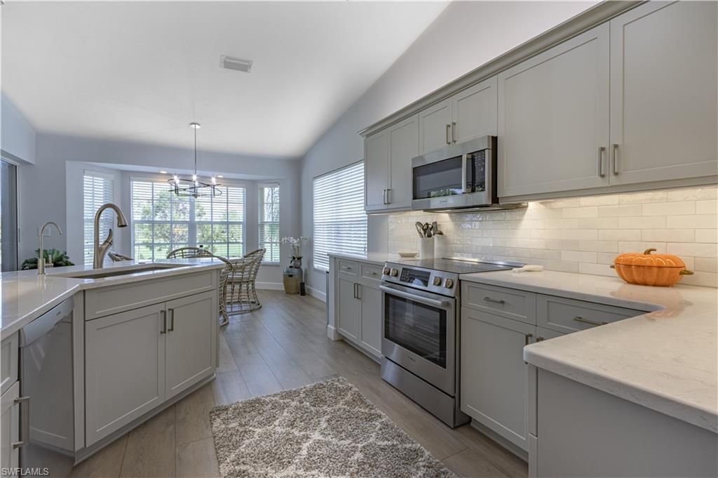Dining room, Interior, Kitchen, Pendant Lights, Stainless Steel Appliances, Wood Texture Flooring