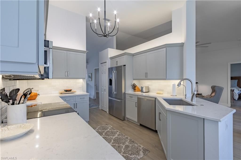 Chandelier, Interior, Kitchen, Pendant Lights, Stainless Steel Appliances, Wood Texture Flooring