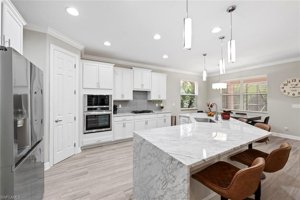 Dining room, Interior, Kitchen, Pendant Lights, Recessed Lighting, Stainless Steel Appliances, Wood Texture Flooring