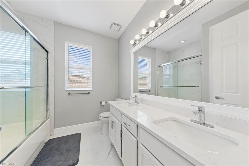 Bathroom, Dual Sink Vanities, Glass Shower, Interior, Marble, Marble Walls, Recessed Lighting