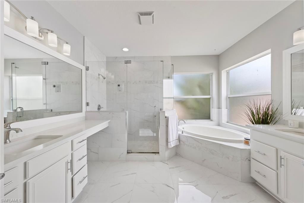 Bathroom, Dual Sink Vanities, Glass Shower, Interior, Marble, Marble Walls, Recessed Lighting