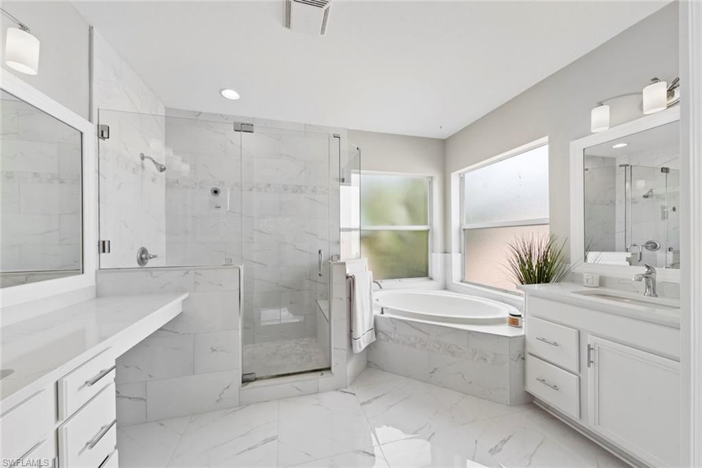 Bathroom, Dual Sink Vanities, Glass Shower, Interior, Marble, Marble Walls, Recessed Lighting