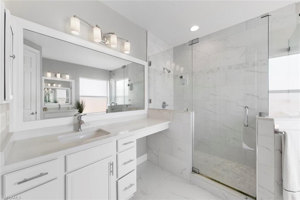 Bathroom, Dual Sink Vanities, Glass Shower, Interior, Marble, Marble Walls, Recessed Lighting