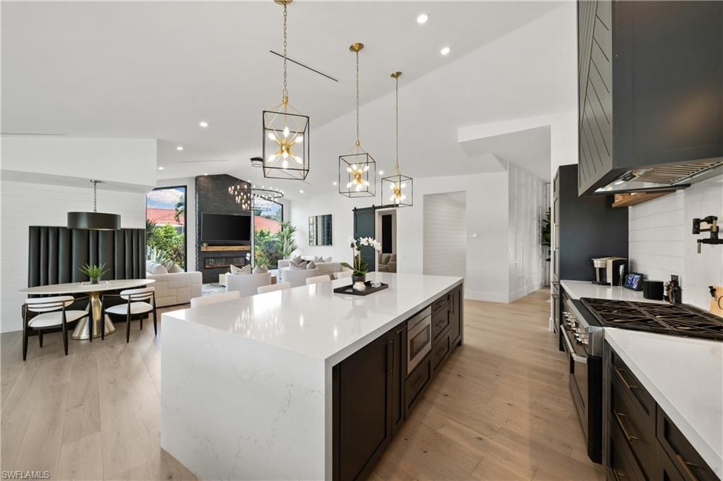 Dining room, Fireplace, Interior, Kitchen, Living room, Pendant Lights, Recessed Lighting, Stainless Steel Appliances, Wood Texture Flooring