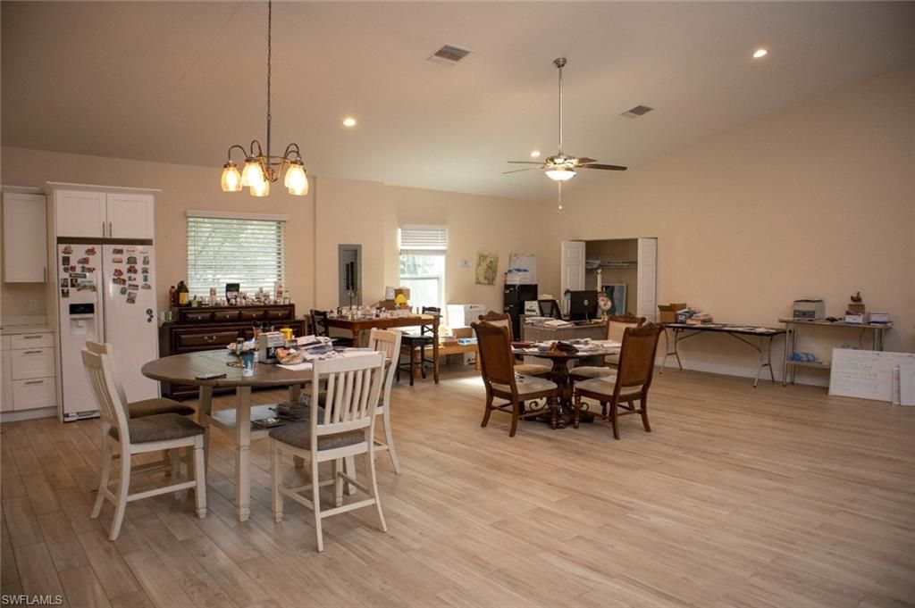 Dining room, Fireplace, Interior, Pendant Lights, Recessed Lighting, Wood Texture Flooring