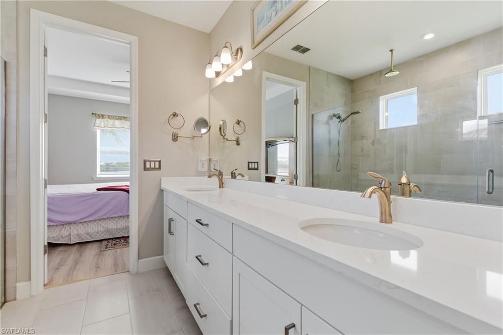 Bathroom, Bedroom, Dual Sink Vanities, Glass Shower, Interior, Recessed Lighting, Wood Texture Flooring