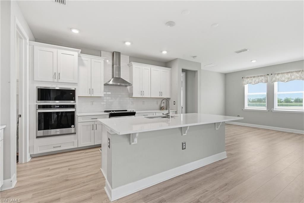 Interior, Kitchen, Recessed Lighting, Stainless Steel Appliances, Water, Wood Texture Flooring