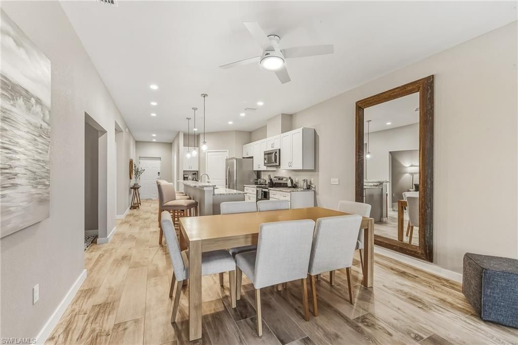 Dining room, Interior, Kitchen, Pendant Lights, Recessed Lighting, Stainless Steel Appliances, Wood Texture Flooring