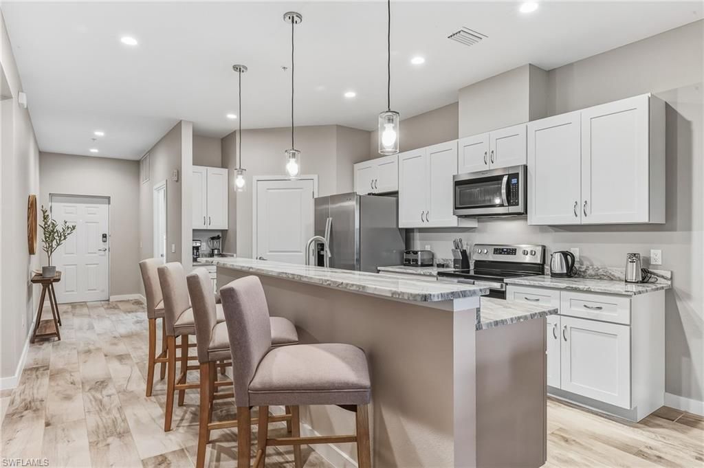 Interior, Kitchen, Pendant Lights, Recessed Lighting, Stainless Steel Appliances, Wood Texture Flooring