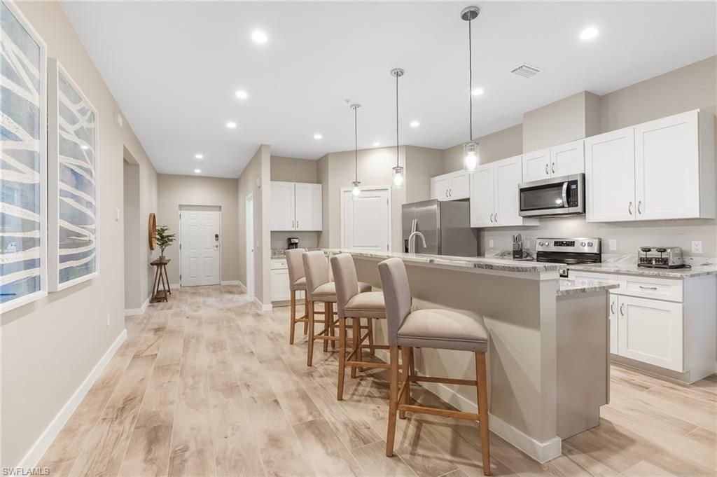 Interior, Kitchen, Pendant Lights, Recessed Lighting, Stainless Steel Appliances, Wood Texture Flooring