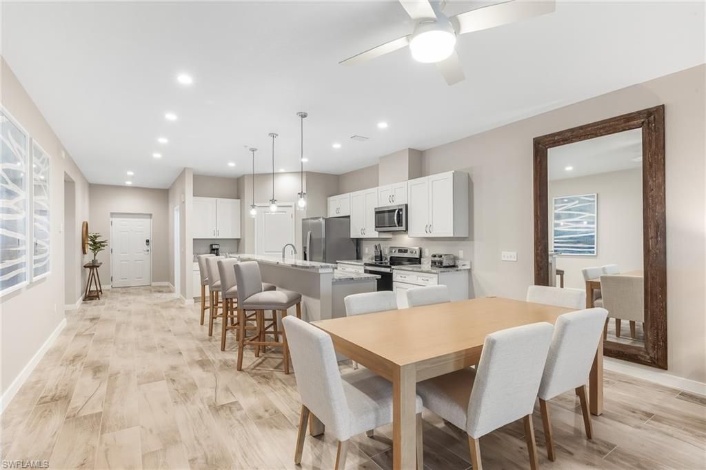 Dining room, Interior, Kitchen, Pendant Lights, Recessed Lighting, Stainless Steel Appliances, Wood Texture Flooring