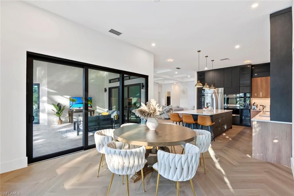 Dining room, Interior, Kitchen, Pendant Lights, Recessed Lighting, Stainless Steel Appliances, Wood Texture Flooring