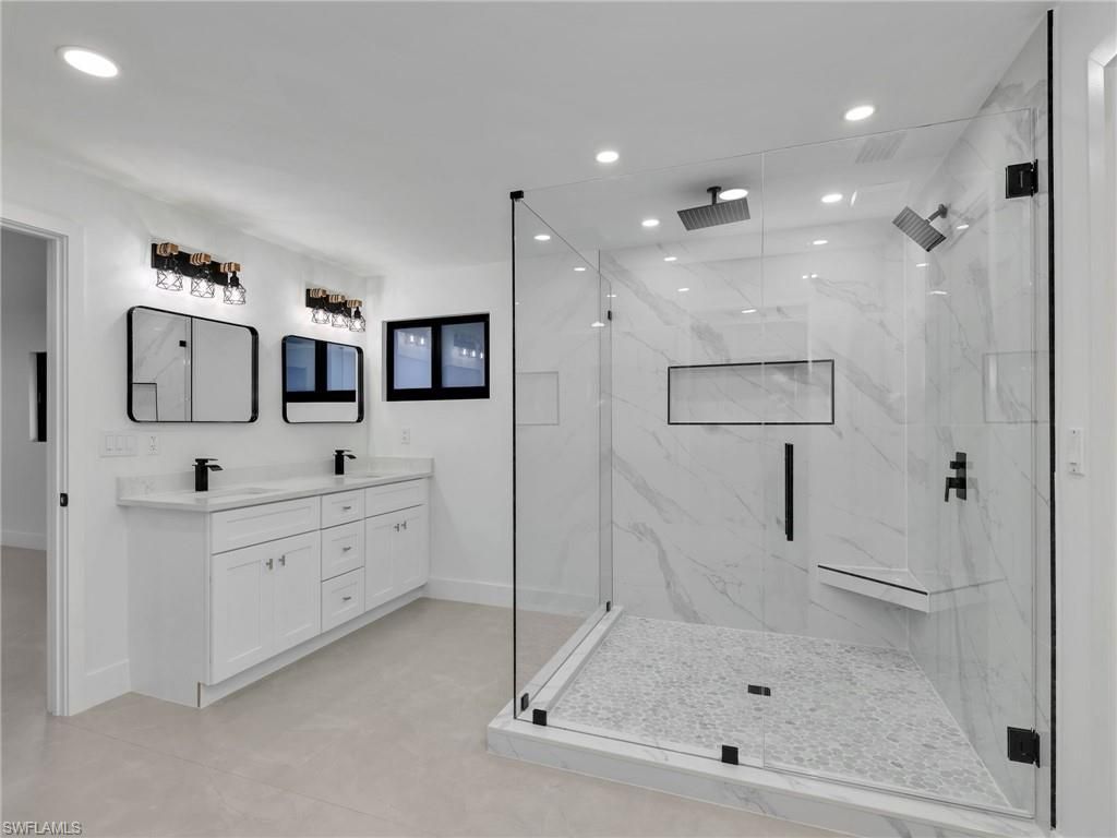 Bathroom, Dual Sink Vanities, Glass Shower, Interior, Marble Walls, Recessed Lighting