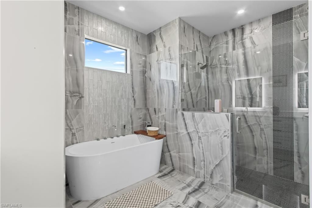 Bathroom, Free Standing Baths, Glass Shower, Interior, Marble, Marble Walls, Recessed Lighting