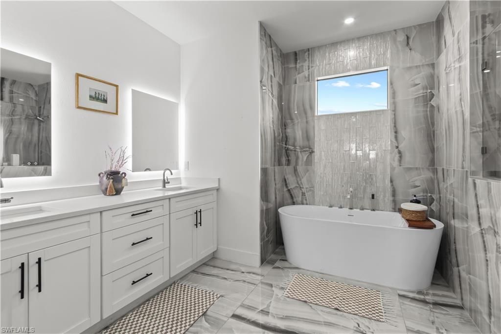 Bathroom, Dual Sink Vanities, Free Standing Baths, Interior, Marble, Marble Walls, Recessed Lighting