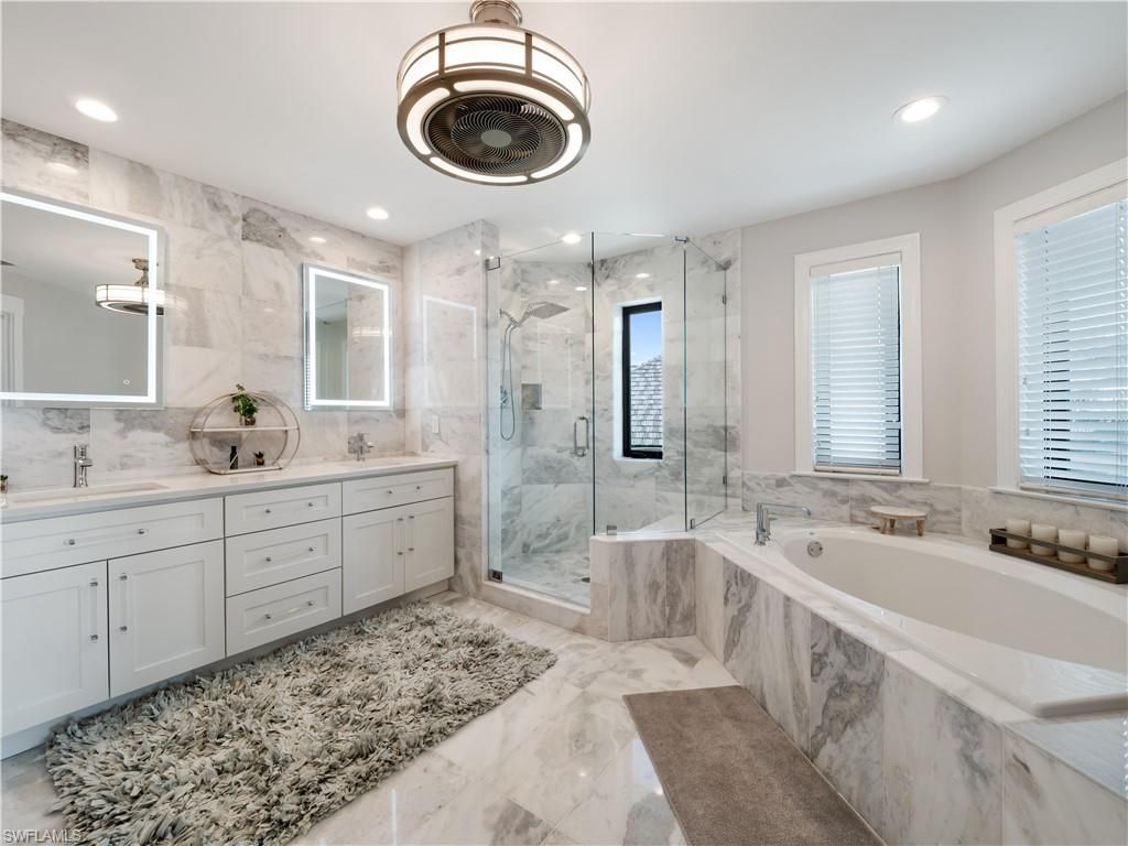 Bathroom, Dual Sink Vanities, Glass Shower, Interior, Marble, Marble Walls, Recessed Lighting