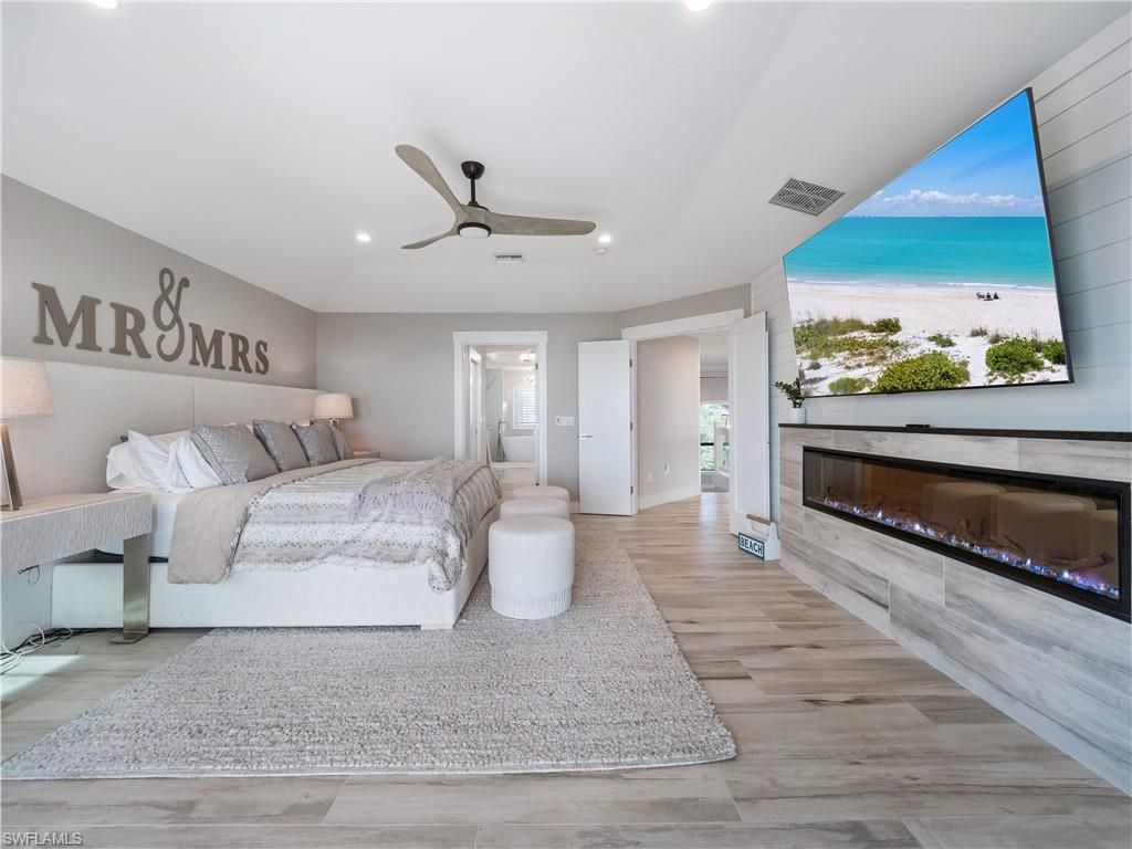 Bedroom, Fireplace, Interior, Recessed Lighting, Water, Wood Texture Flooring