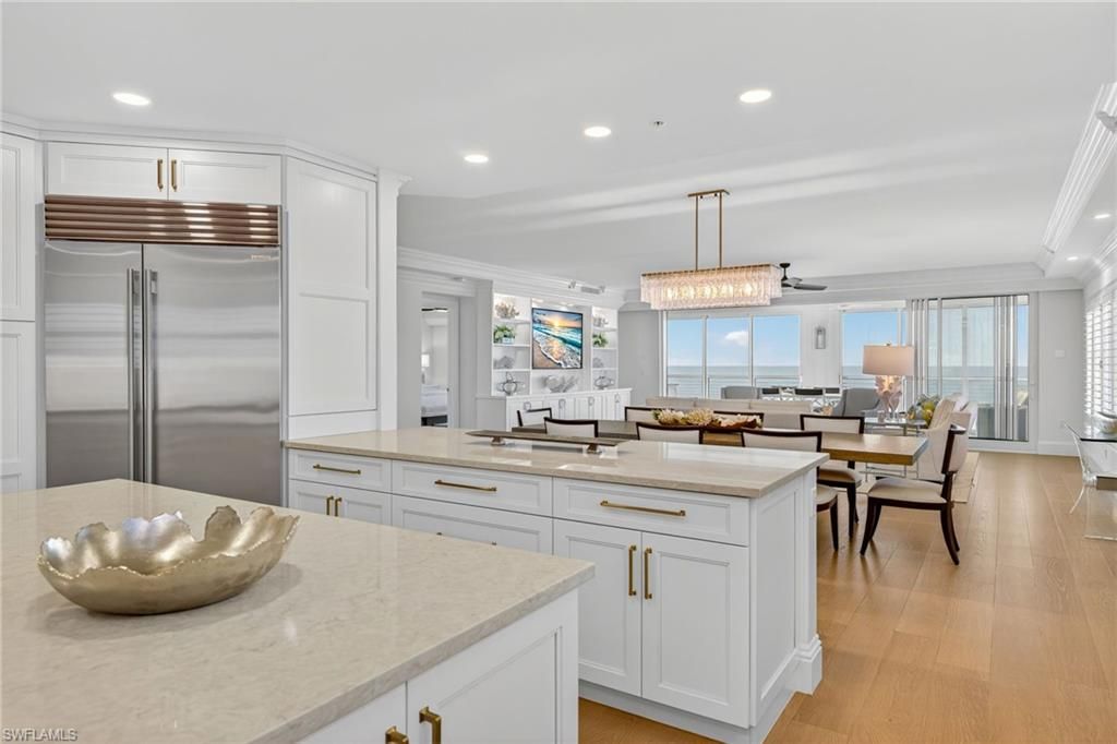 Chandelier, Dining room, Interior, Kitchen, Living room, Pendant Lights, Recessed Lighting, Stainless Steel Appliances, Wood Texture Flooring