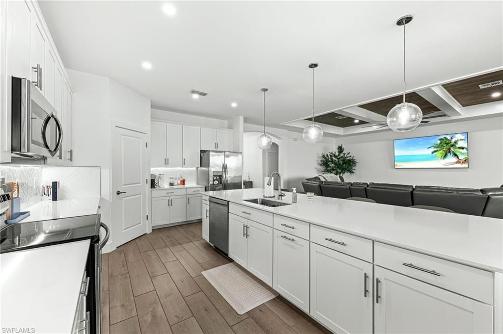 Interior, Kitchen, Pendant Lights, Recessed Lighting, Stainless Steel Appliances, Wood Texture Flooring