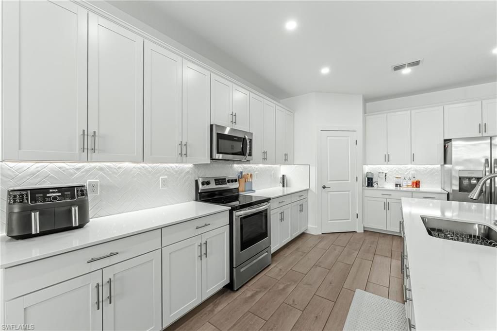 Interior, Kitchen, Recessed Lighting, Stainless Steel Appliances, Wood Texture Flooring