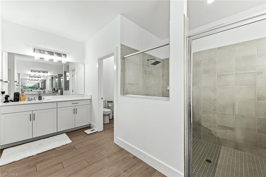 Bathroom, Dual Sink Vanities, Glass Shower, Interior, Wood Texture Flooring