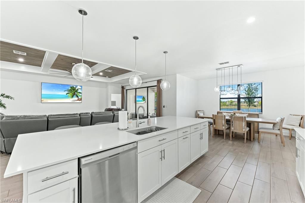 Dining room, Interior, Kitchen, Living room, Pendant Lights, Recessed Lighting, Stainless Steel Appliances, Wooden Ceilings, Wood Texture Flooring