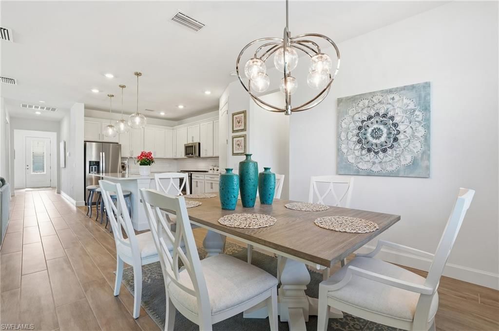Dining room, Interior, Kitchen, Pendant Lights, Recessed Lighting, Stainless Steel Appliances, Wood Texture Flooring
