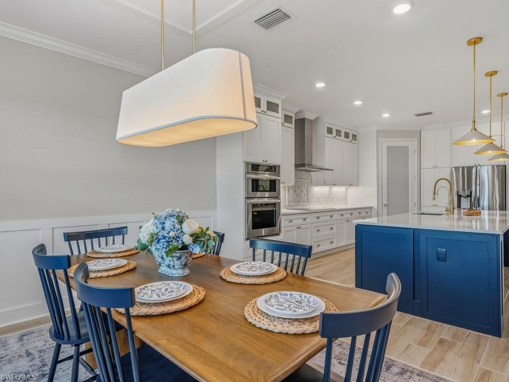 Dining room, Interior, Kitchen, Pendant Lights, Recessed Lighting, Stainless Steel Appliances, Wood Texture Flooring
