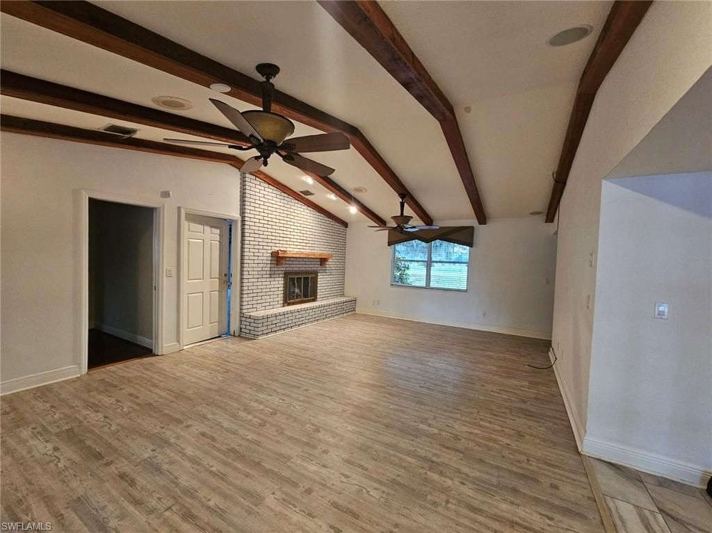 Empty room, Fireplace, Interior, Stone Walls, Wooden Beams, Wood Texture Flooring