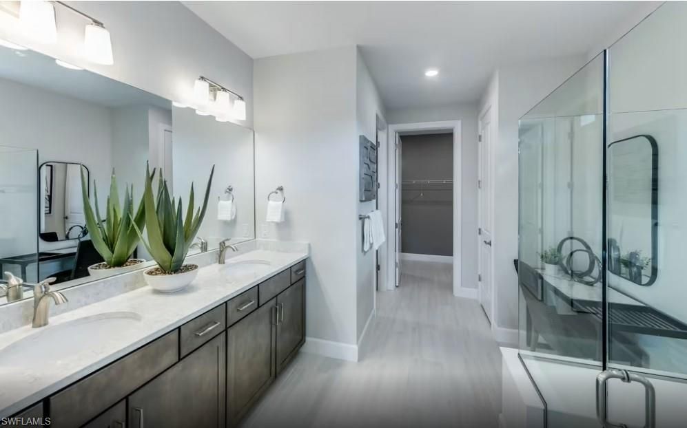 Bathroom, Dual Sink Vanities, Glass Shower, Interior, Recessed Lighting, Wood Texture Flooring