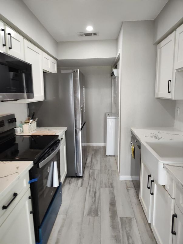 Interior, Kitchen, Recessed Lighting, Washer, Wood Texture Flooring