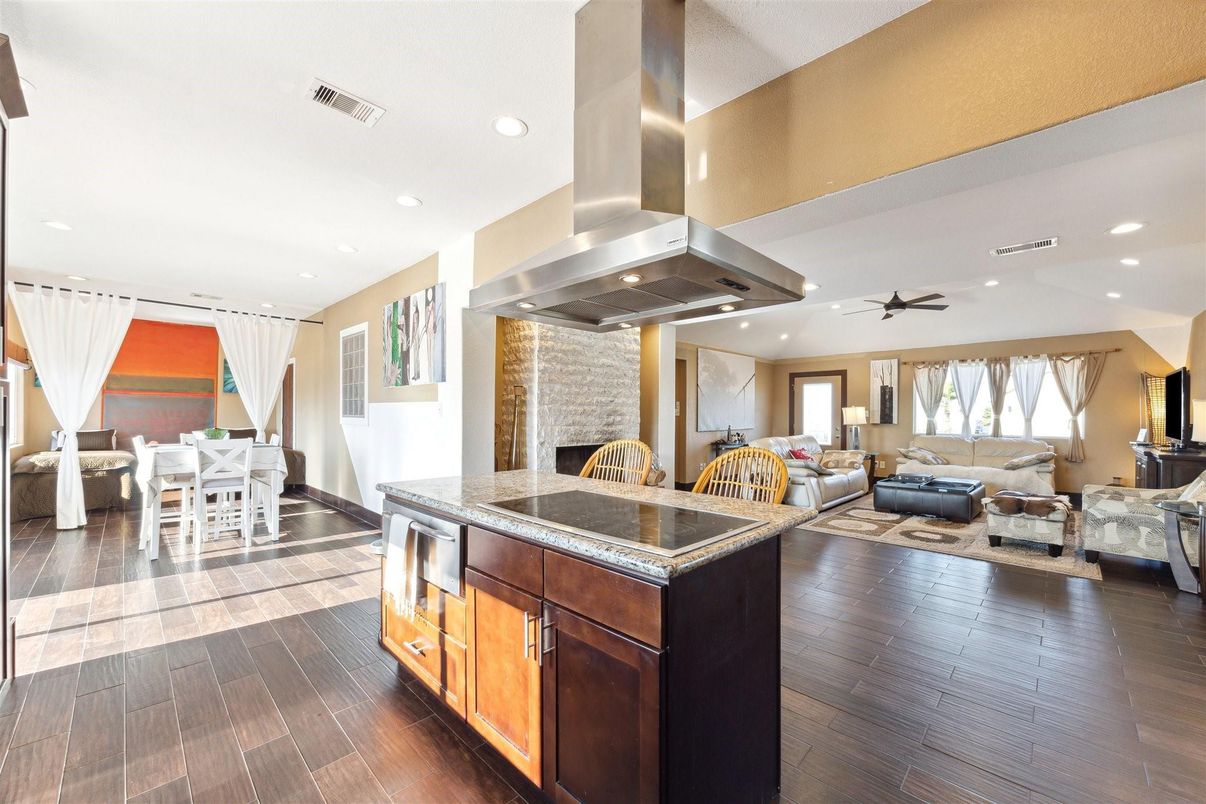 Dining room, Fireplace, Interior, Living room, Recessed Lighting, Wood Texture Flooring