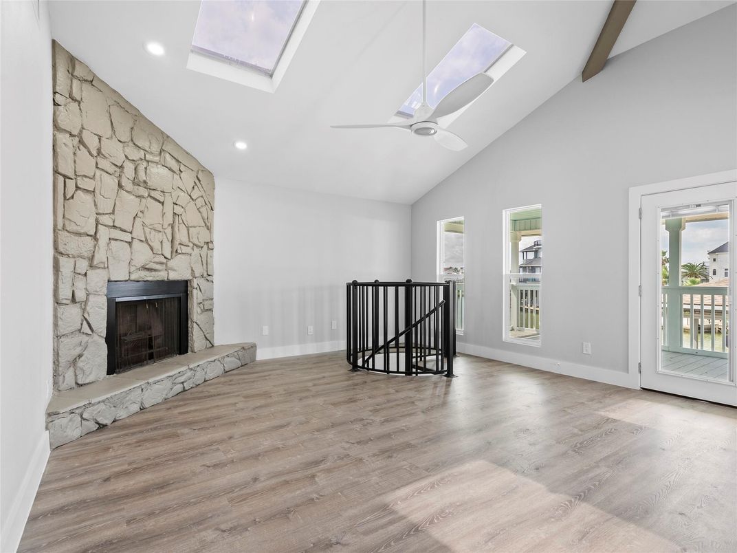 Fireplace, Interior, Recessed Lighting, Stone Walls, Wood Texture Flooring