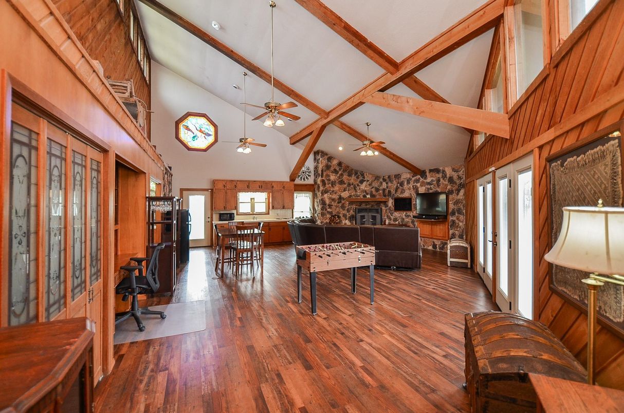 Fireplace, Game Room, Interior, Stone Walls, Wooden Beams, Wood Texture Flooring