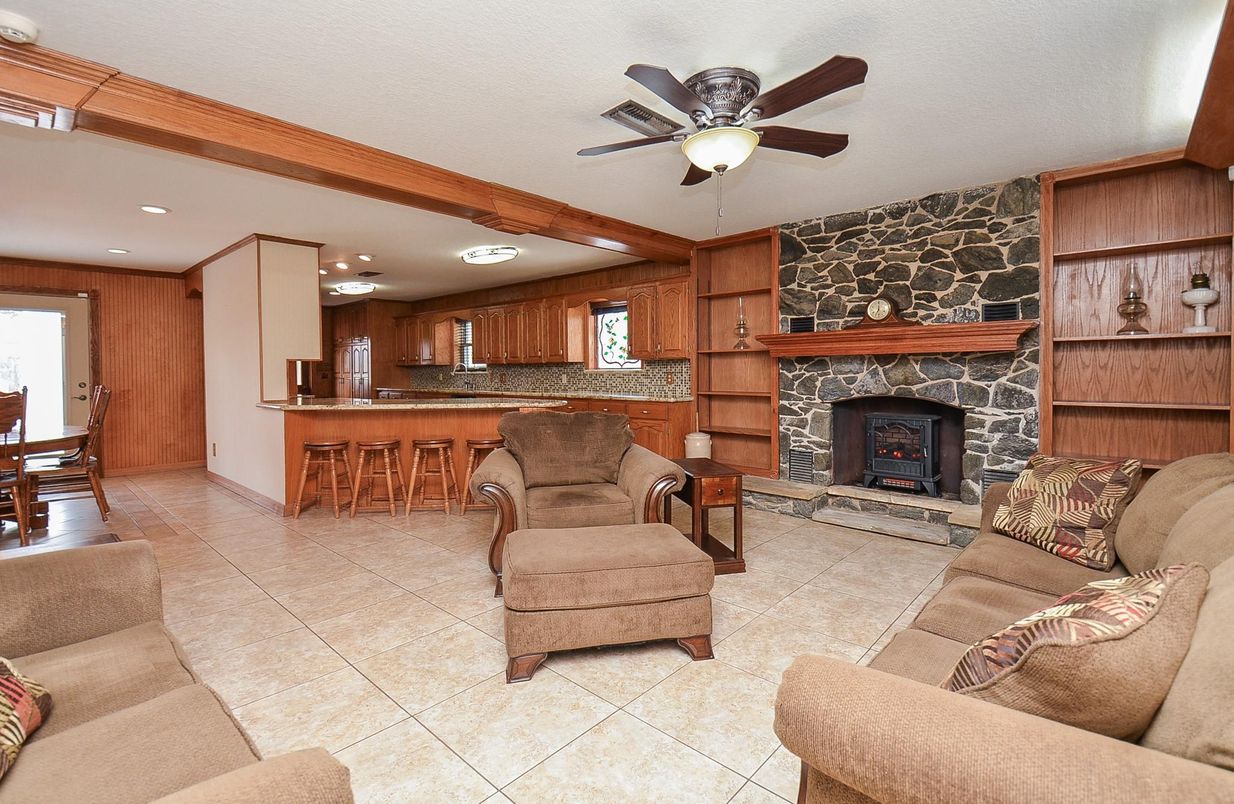 Dining room, Fireplace, Interior, Kitchen, Living room, Recessed Lighting, Stone Walls, Wooden Beams