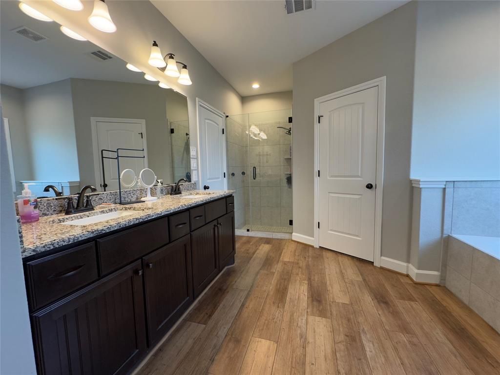 Bathroom, Dual Sink Vanities, Glass Shower, Interior, Recessed Lighting, Wood Texture Flooring