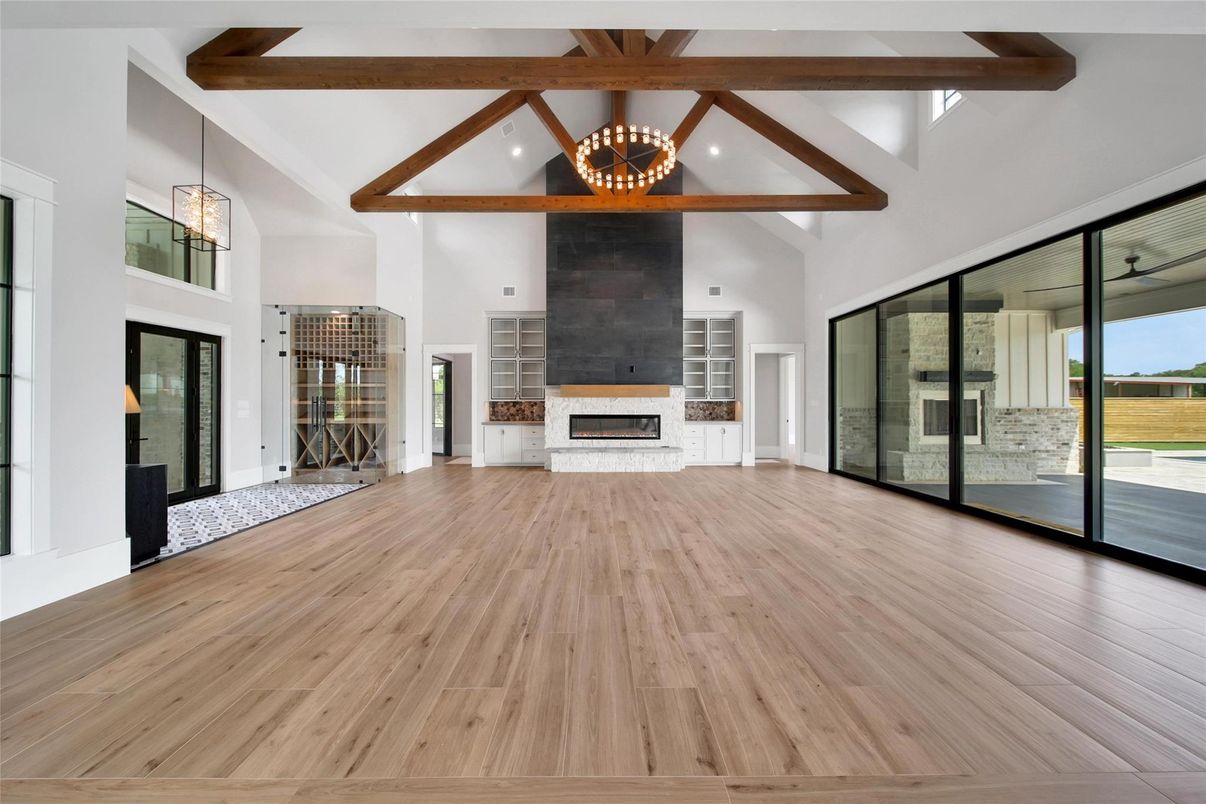Empty room, Fireplace, Interior, Pendant Lights, Recessed Lighting, Wooden Beams, Wood Texture Flooring